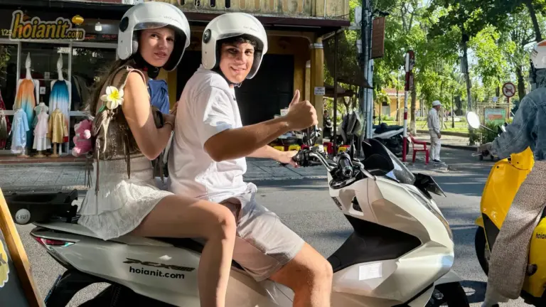 Couple riding a rental scooter in Hoi An