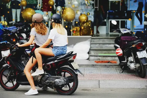 Two travellers on a rental scooter in Vietnam