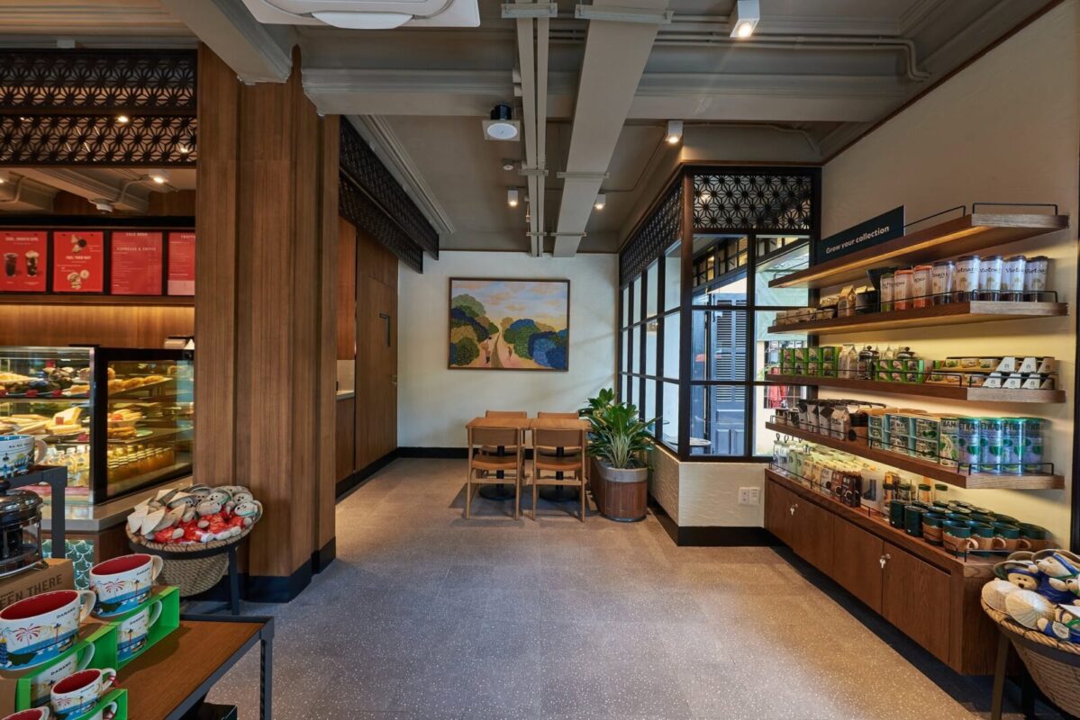 Merchandise shelves and seating area inside Starbucks Hoi An
